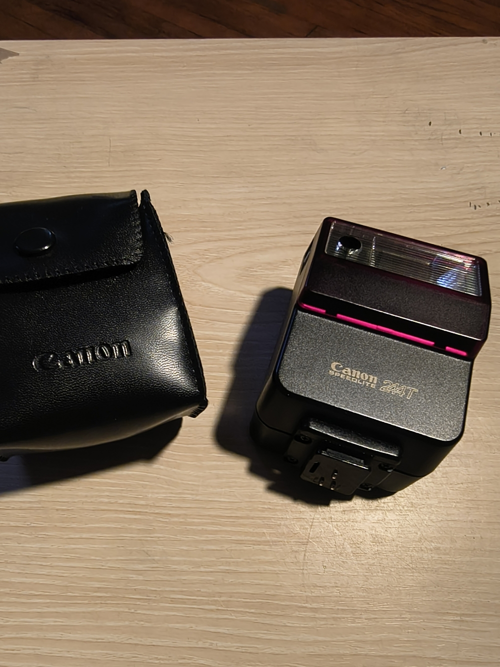 vintage Canon Speedlite 244T electronic flash unit with its leather case,